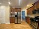 Spacious kitchen with stainless steel refrigerator and range and dark countertops at 71 Anita Se Pl, Mableton, GA 30126