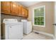 This laundry room features updated appliances and a window for natural light at 71 Anita Se Pl, Mableton, GA 30126