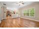 Open-concept living room features hardwood floors, large windows, and seamless flow to kitchen at 71 Anita Se Pl, Mableton, GA 30126