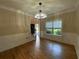 Bright living room with hardwood floors, wainscoting, crown molding, and lots of natural light at 71 Anita Se Pl, Mableton, GA 30126