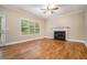 Bright living room with hardwood floors, fireplace, and large window, offering a comfortable and inviting atmosphere at 71 Anita Se Pl, Mableton, GA 30126