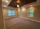 Large main bedroom with carpet, tray ceiling, and big windows at 71 Anita Se Pl, Mableton, GA 30126