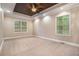 Spacious main bedroom with tray ceiling, neutral carpeting, and recessed lighting at 71 Anita Se Pl, Mableton, GA 30126