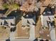 An aerial view showcasing a well-maintained home nestled among mature trees in a tidy suburban neighborhood setting at 1070 Cureton Dr, Austell, GA 30106