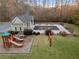 Aerial view of community pool, playground, and surrounding wooded area at 1070 Cureton Dr, Austell, GA 30106