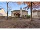 Wide backyard view featuring a covered patio and detailed landscaping and stepping stones at 1070 Cureton Dr, Austell, GA 30106