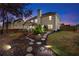The backyard has a stepping stone pathway, landscaped garden, and covered porch at 1070 Cureton Dr, Austell, GA 30106