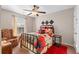 Comfortable bedroom featuring a cozy armchair, accent rug, and stylish decorations at 1070 Cureton Dr, Austell, GA 30106