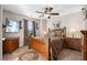 Cozy bedroom with a ceiling fan, TV, and two matching wooden nightstands at 1070 Cureton Dr, Austell, GA 30106
