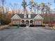View of community clubhouse with brick facade and covered entrance at 1070 Cureton Dr, Austell, GA 30106