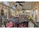 Inviting covered patio featuring ceiling fans, charming decor and comfortable seating, perfect for outdoor relaxation and entertaining at 1070 Cureton Dr, Austell, GA 30106