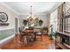 Elegant dining room with a chandelier, hardwood floors, and space for entertaining at 1070 Cureton Dr, Austell, GA 30106