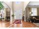 Bright and welcoming entryway with high ceilings, hardwood floors, and elegant decor at 1070 Cureton Dr, Austell, GA 30106