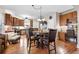 Open kitchen features wood floors, wooden cabinets, stainless steel appliances, a breakfast nook and a built in desk at 1070 Cureton Dr, Austell, GA 30106