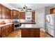 Eat-in kitchen boasts wood floors, stainless appliances, island with storage, lots of cabinets and plenty of counter space at 1070 Cureton Dr, Austell, GA 30106