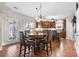 Well-lit kitchen with hardwood floors, wooden cabinets and a cozy breakfast nook with large window at 1070 Cureton Dr, Austell, GA 30106
