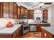 Updated eat-in kitchen features wood floors, stainless appliances, ample cabinets and plenty of counter space at 1070 Cureton Dr, Austell, GA 30106