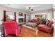 Inviting living room with a brick fireplace, large windows, and comfortable seating arrangement at 1070 Cureton Dr, Austell, GA 30106