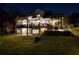 Backyard view showing a multi-level deck, patio, outdoor seating, and manicured lawn at 1226 Goodwin Ne Rd, Atlanta, GA 30324