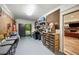 Basement with access to the outdoors, storage shelves and views of the main floor at 1226 Goodwin Ne Rd, Atlanta, GA 30324