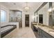 Bathroom featuring a walk-in shower, a soaking tub, and dual vanities with granite countertops at 1226 Goodwin Ne Rd, Atlanta, GA 30324