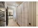 Hallway bathroom with full shower and tub featuring modern fixtures at 1226 Goodwin Ne Rd, Atlanta, GA 30324