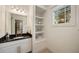 Bathroom featuring a vanity with granite countertop and built-in shelving at 1226 Goodwin Ne Rd, Atlanta, GA 30324