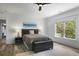 Bedroom with large window, ceiling fan, and modern decor at 1226 Goodwin Ne Rd, Atlanta, GA 30324