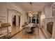 Bright dining room boasts modern chandelier, elegant decor, and ample natural light from large window at 1226 Goodwin Ne Rd, Atlanta, GA 30324