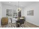 Dining room featuring chandelier lighting, a round table, and natural light at 1226 Goodwin Ne Rd, Atlanta, GA 30324