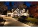 Inviting two-story home with stone and siding, showcasing a manicured lawn, elegant landscaping and a spacious driveway at 1226 Goodwin Ne Rd, Atlanta, GA 30324