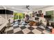 Spacious home gym with a large checkerboard floor and an array of exercise equipment at 1226 Goodwin Ne Rd, Atlanta, GA 30324