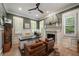 Stylish home office features custom built-ins, a decorative fireplace, and a ceiling fan at 1226 Goodwin Ne Rd, Atlanta, GA 30324