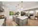 Open kitchen with large island, stainless appliances, and seamless flow to the living area at 1226 Goodwin Ne Rd, Atlanta, GA 30324
