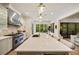 A spacious kitchen offers lots of counter space, stainless steel appliances, and eat-in dining with a backyard view at 1226 Goodwin Ne Rd, Atlanta, GA 30324