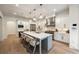 Gourmet kitchen with large island, stainless steel appliances, and elegant pendant lighting at 1226 Goodwin Ne Rd, Atlanta, GA 30324