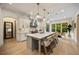 Gourmet kitchen with oversized island, pendant lighting, and views of the outdoor greenery at 1226 Goodwin Ne Rd, Atlanta, GA 30324