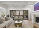 Bright living room with a fireplace and access to the screened-in porch for indoor-outdoor living at 1226 Goodwin Ne Rd, Atlanta, GA 30324
