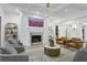 Bright living room features a fireplace with decorative tile, coffered ceilings, and stylish decor at 1226 Goodwin Ne Rd, Atlanta, GA 30324