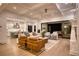 Open-concept living room with coffered ceilings, modern furniture, and seamless indoor-outdoor flow at 1226 Goodwin Ne Rd, Atlanta, GA 30324