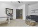 Open living room area with a large couch, decorative coffee table, and modern decor at 1226 Goodwin Ne Rd, Atlanta, GA 30324