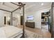 Main bedroom with hardwood floors, a ceiling fan, a mounted TV, and views of other rooms at 1226 Goodwin Ne Rd, Atlanta, GA 30324