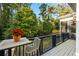 Back patio with a dining table and chair overlooking the backyard landscaping at 1226 Goodwin Ne Rd, Atlanta, GA 30324