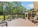 Enjoy the view from this back deck with railings, seating, and small table at 1522 Sprayberry Dr, Marietta, GA 30066
