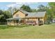 This home has a large green backyard with a porch and deck at 1522 Sprayberry Dr, Marietta, GA 30066