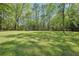 Enjoy the outdoors in the lush green backyard with shed and mature trees at 1522 Sprayberry Dr, Marietta, GA 30066