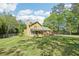 Large backyard view with a deck and screened in porch at 1522 Sprayberry Dr, Marietta, GA 30066