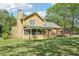 Charming home featuring a screened porch, spacious deck, and a large, lush green backyard for outdoor enjoyment at 1522 Sprayberry Dr, Marietta, GA 30066
