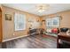 Bedroom with two windows, hardwood floors, ceiling fan, and neutral wall paint at 1522 Sprayberry Dr, Marietta, GA 30066