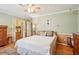 Charming bedroom showcasing wood floors, a ceiling fan, and lots of natural light at 1522 Sprayberry Dr, Marietta, GA 30066